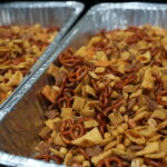 aluminum pans of Chex mix