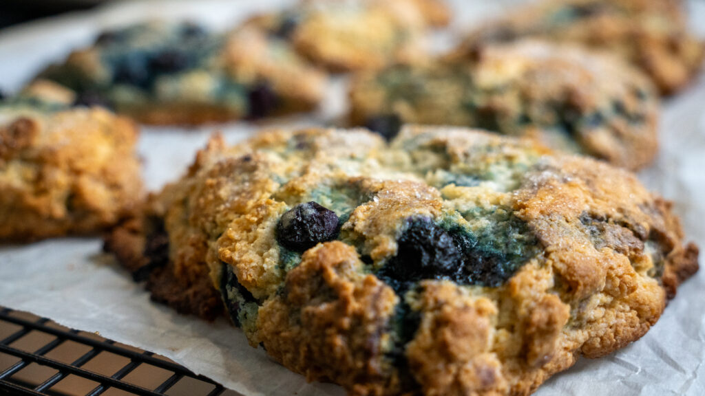 blueberry scones on cooling rack and wax paper