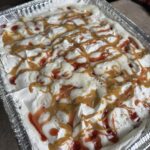 peanut butter and jelly cake in an aluminum pan