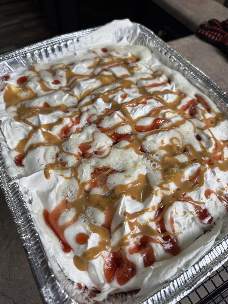 peanut butter and jelly cake in an aluminum pan
