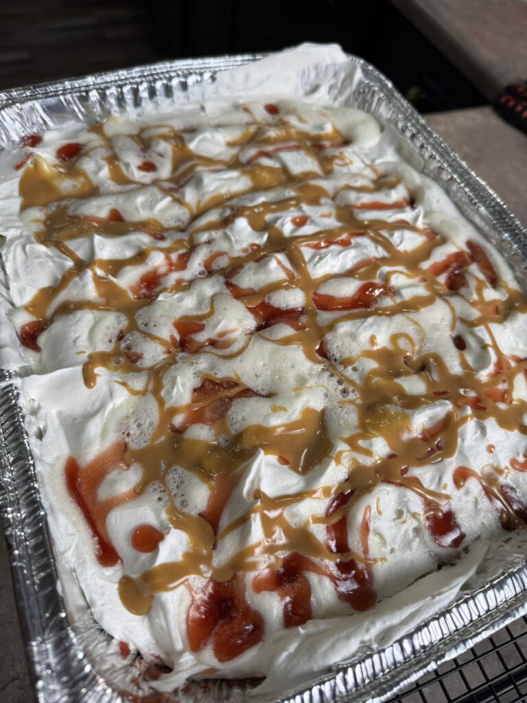 peanut butter and jelly cake in an aluminum pan