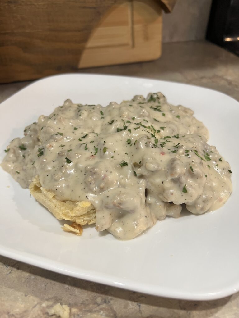 biscuits and gravy on a white plate