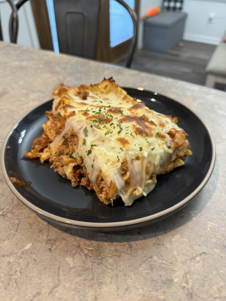 lasagna on black plate