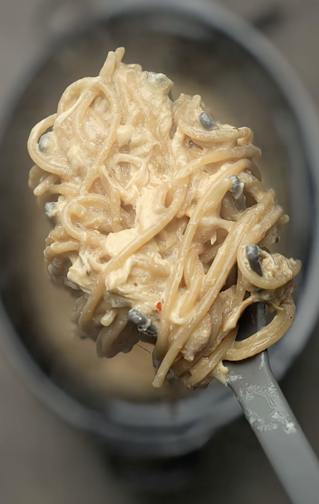 Italian chicken on large serving spoon