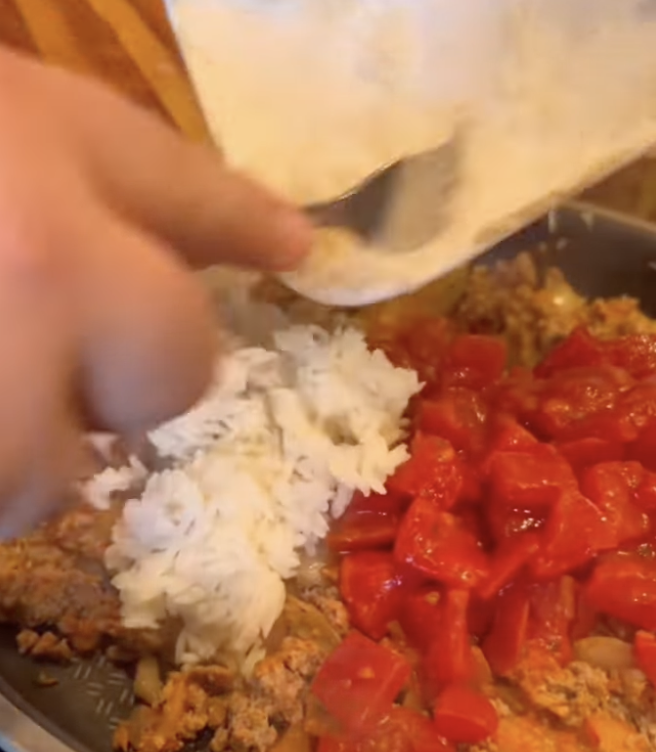 adding rice to mixture