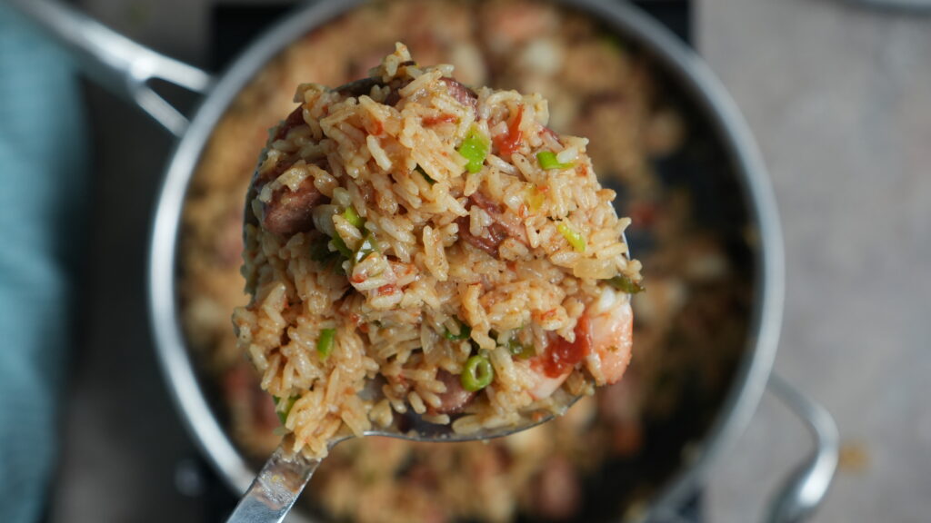 jambalaya in a pot on a ladle 