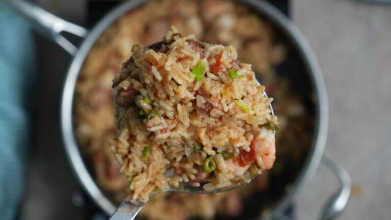 jambalaya in a pot on a ladle