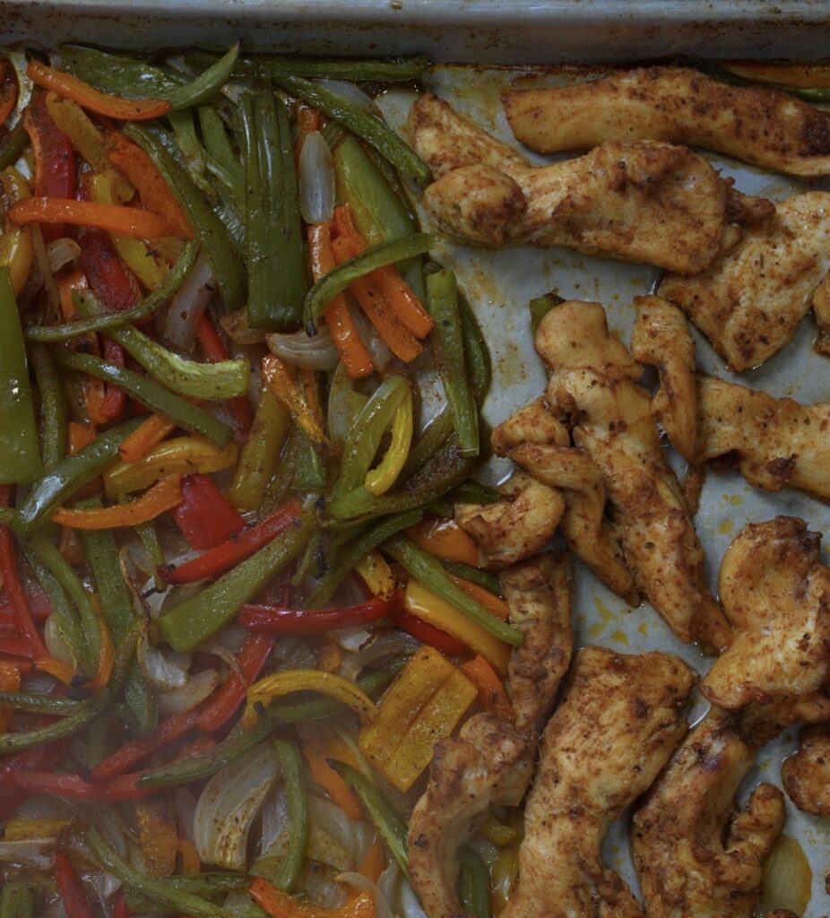 baked chicken and veggies on sheet pan