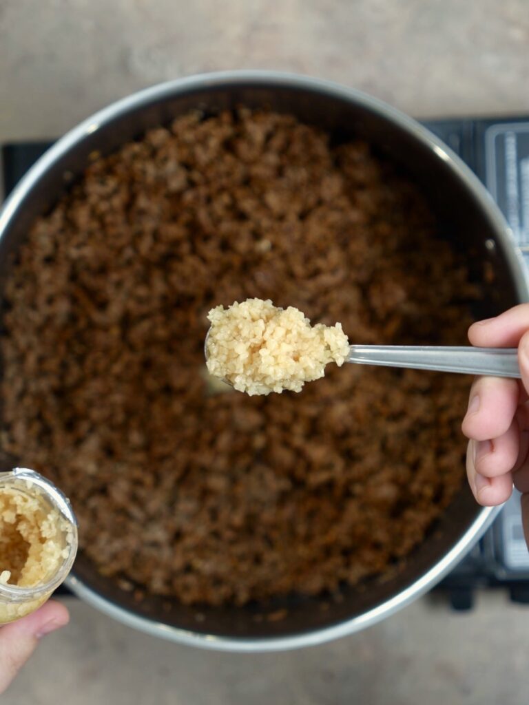 pot of ground beef with garlic
