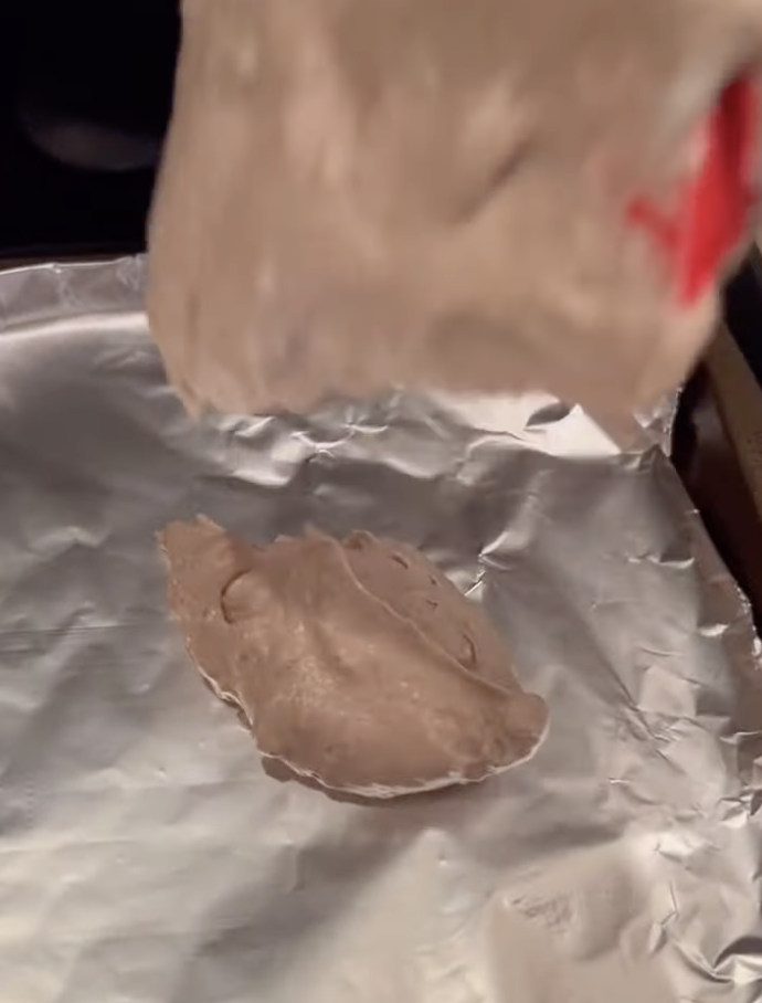placing dollop of cheesecake bite on aluminum foil pre freezing