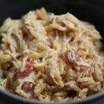 bowl of crockpot creamy cajun chicken orzo