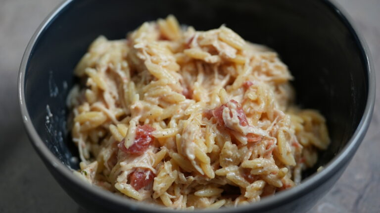 bowl of crockpot creamy cajun chicken orzo