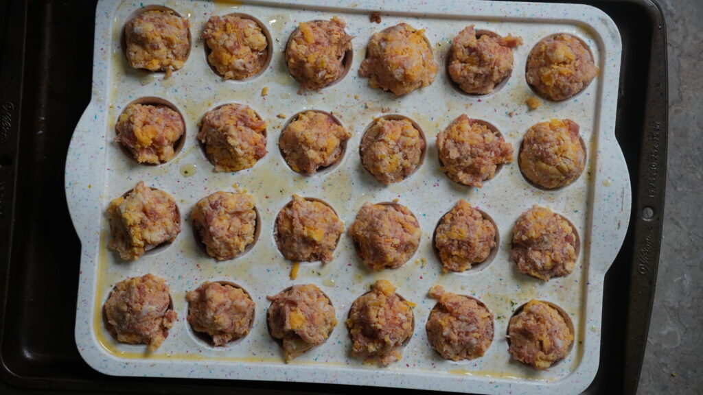 putting balls into muffin tin