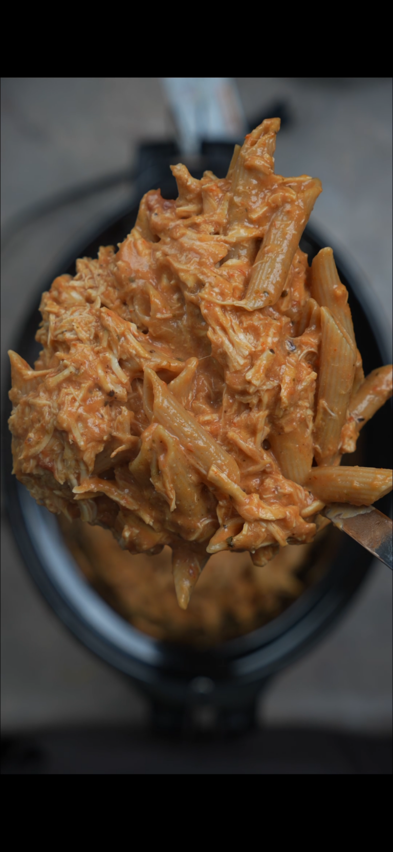 creamy chicken pasta on a spoon