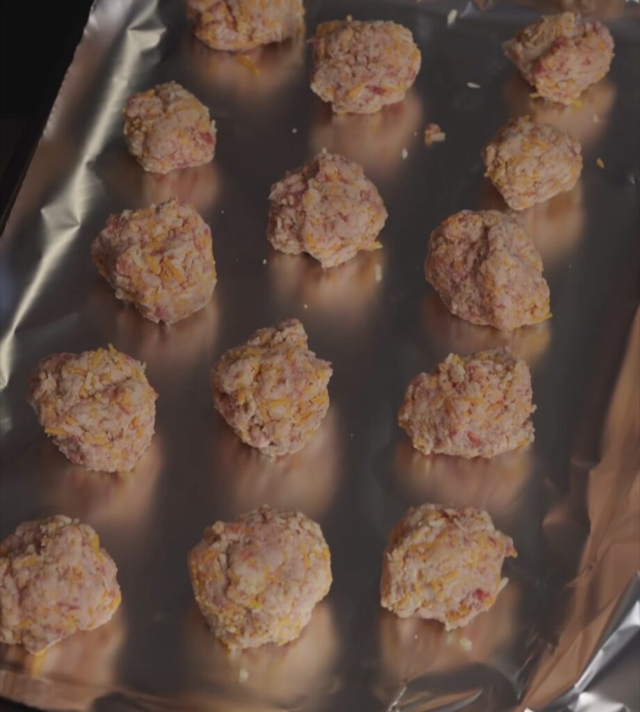 sausage balls on cooking sheet