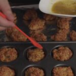 brushing butter of sausage balls