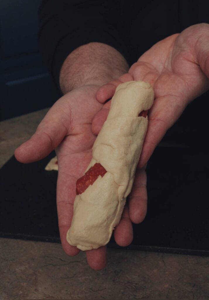 wrapped cheesy pizza stuffer before cooking