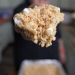 Justin holding a rice crispy treat square