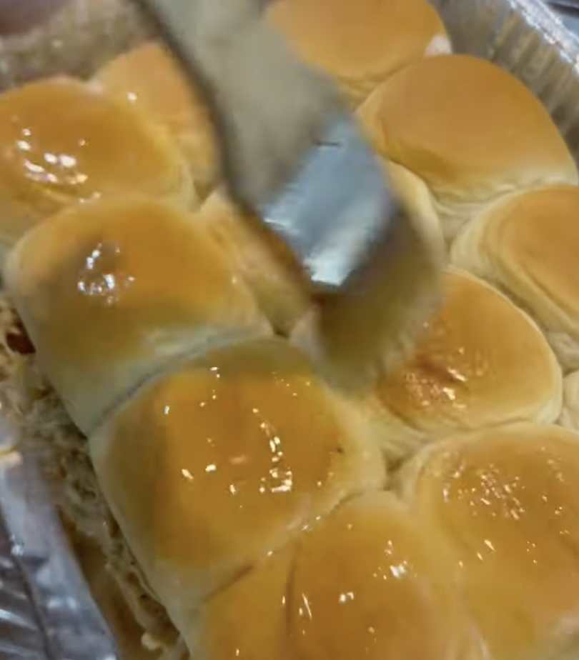 buttering the top of the buns