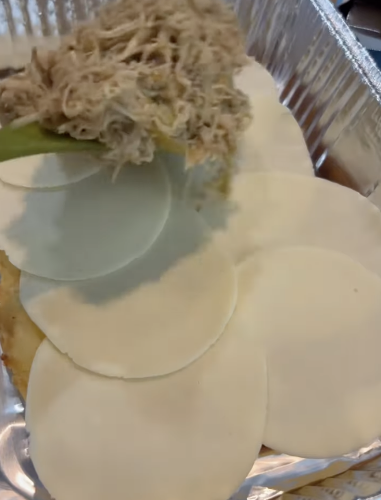 adding cheese and filling to slider bottoms