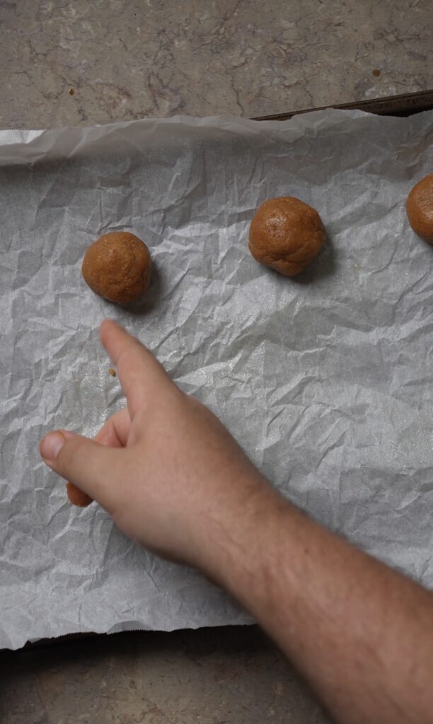 balls of cookie on parchment paper