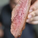Justin holding steak cut