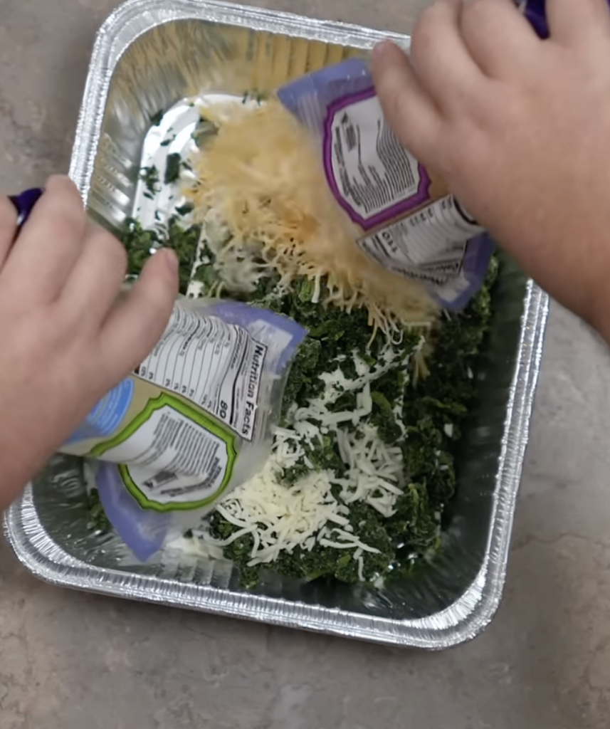 adding shredded cheese