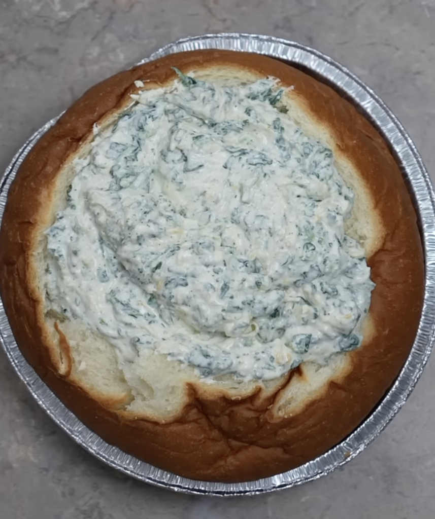 add spinach dip to bread bowl