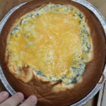 bread bowl with melted cheese on top