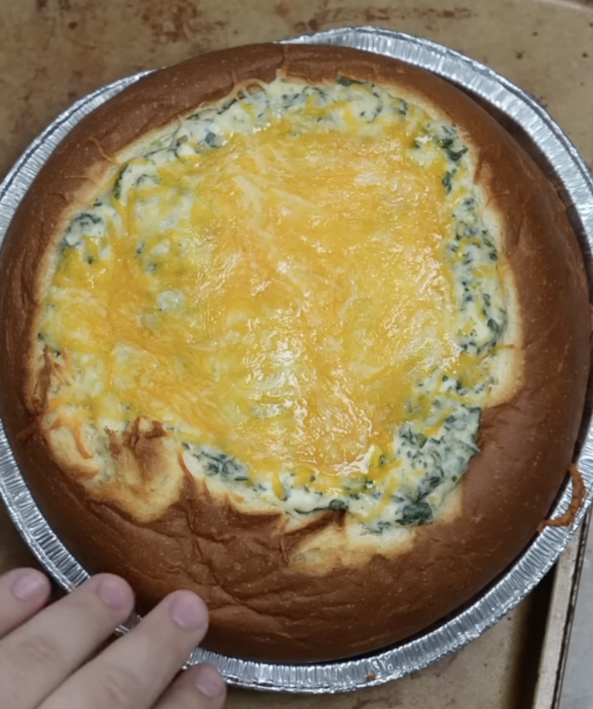 bread bowl with melted cheese on top