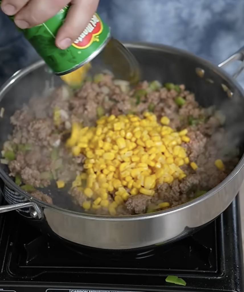 adding corn to mixture