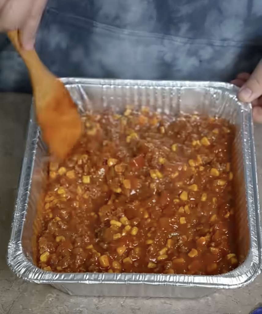 adding mixture to pan