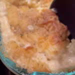 dishing up cheesy Alfredo bake