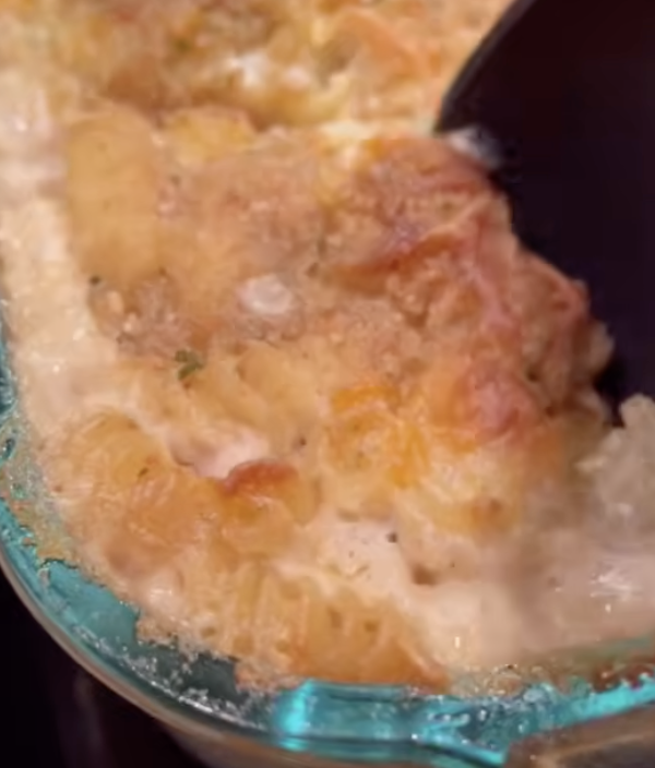 dishing up cheesy Alfredo bake