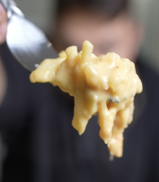 close up of cheesy potatoes on fork